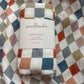 Finn Checkered Organic Muslin Swaddle Wrap